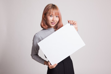 Naklejka premium Young Asian woman with white blank sign.