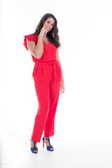 beautiful smiling young girl with long black hair in red dress,on white background 