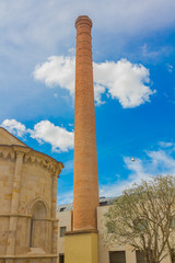 Fototapeta premium Old industrial chimney in the old town of zamora, spain