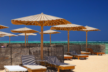Egyptian parasol on the beach of Red Sea. Marsa Alam, Egypt.