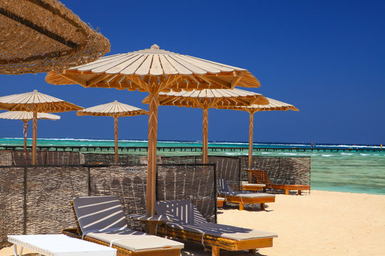 Egyptian parasol on the beach of Red Sea. Marsa Alam, Egypt.