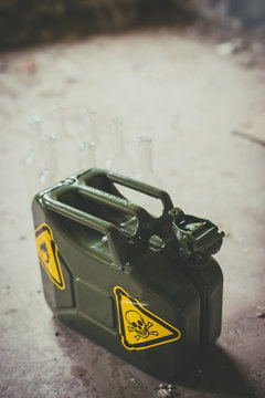 Terrorism. Molotov cocktail. Green military jerrycan with empty bottles