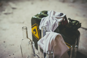 Terrorism. Molotov cocktail. Green military jerrycan with empty bottles