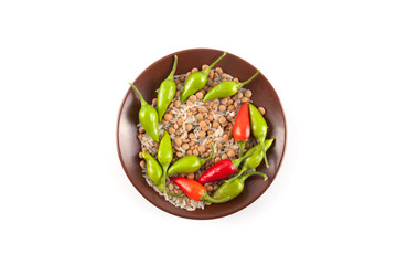 Raw lentils and rice with chilli pepper.