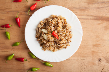 Lentils and rice with chilli pepper.