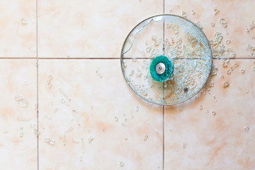Fototapeta premium Broken glass lid on the floor.