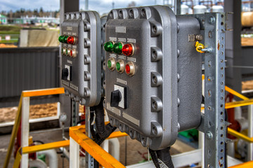 Part of power plant control panel with switches and lamps