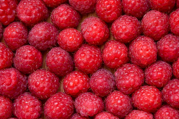 Raspberry organic background. Fresh raspberries from village garden. Ecological berries for desserts, cakes, smoothie or jam.