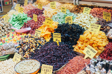 Istanbul. Turkey.  Dried fruits on the counter. The Egyptian Bazaar.  Tablets with the name of sweets and the price for the goods