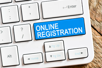 Online registration. Computer white keyboard with online registration.