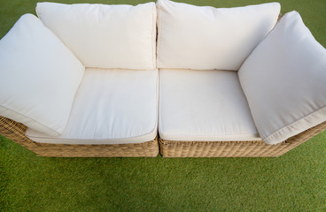 Modern fabric sofa , top view in the garden background.