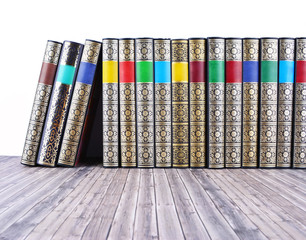 Old books on rustic wooden table.