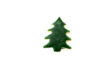 ein leckeres Plätzchen (Weihnachtsbaum) liegt auf weißem Hintergrund