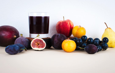Grape juice with autumn seasonal fruits.