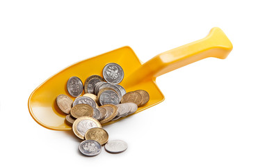 Coins Russia in a small yellow shovel on white background