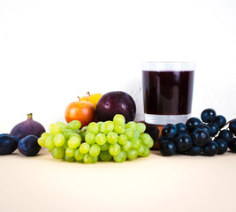 Grape juice with autumn seasonal fruits.