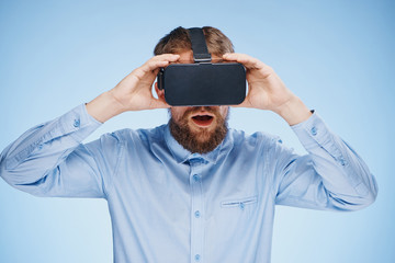 1456860 man in virtual reality glasses on a blue background