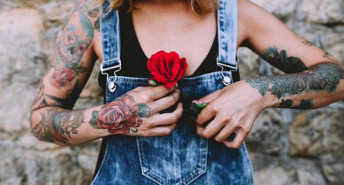 woman holding a rose