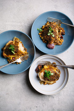 Moroccan spiced chicken thighs with couscous.