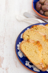 vegetable soup in bowl and olives with corn bread