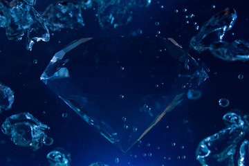 Photo of a blue diamond in water with bubbles floating.