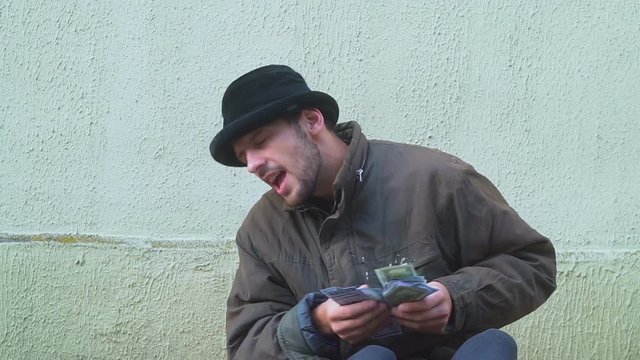 happy American homeless with big money