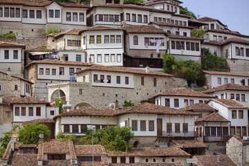 Fototapeta na wymiar June 2014 - walls and windows of medieval houses built on a hillside in town Berat, Albania, inscribed on the UNESCO World Heritage List