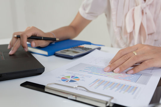 Businessman check profit document and calculate about and note data cost at home ,Finance managers task,Currency investment that think carefully. Concept business and finance