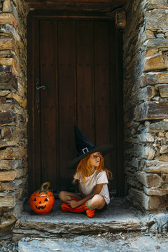 Adorable girl posing on porch