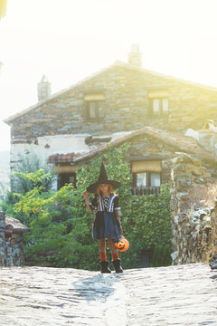 Little girl in witch costume