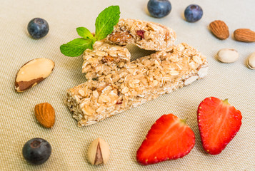 Cereal granola bars against white background. Concept of healthy food eating, fitness, and diet.