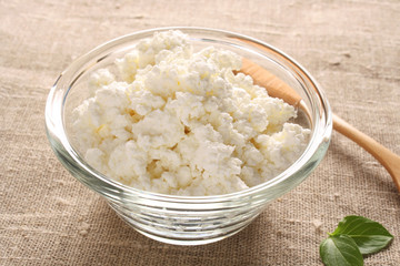 cottage cheese in a glass bowl on the fabric