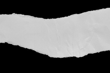 Ripped paper on black background, space for advertising copy.
