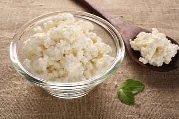 cottage cheese in a glass bowl on the fabric