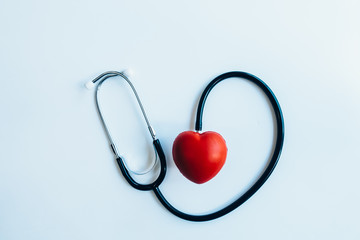 close up red heart and stethoscope on white background, world health day concept, process vintage tone