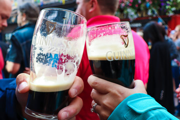 Clinking beer glasses