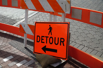 detour sign on the pedestrian sidewalk