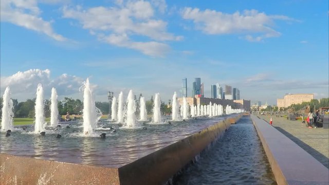fountains in city park on a summer day timelapse