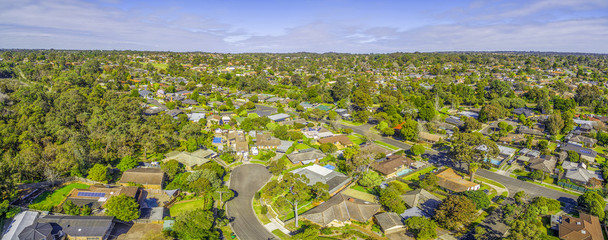 Suburbian houses in Australia. Aerial panorama on bright sunny day