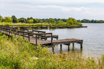 The boat dock at Mount Trashmore Park, a city park in Virginia Beach, Virginia created on the site of a former landfill.  It has two man-made mountains, the lake, walking trails, and picnic areas.