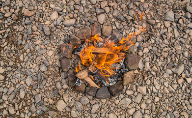 Bonfire on the beach. Fire on the beach - selective focus, Lonely fire on the seashore in autumn
