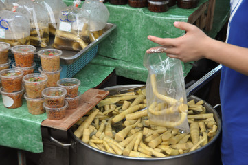 Boiled sweet bamboo in Thai street market.
