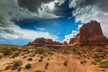 Dramatic storm clouds in Arches National Park and red sandstone formations