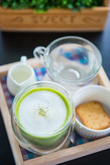 Set of hot matcha green tea with milk foam