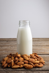 almond milk in bottle with Almonds