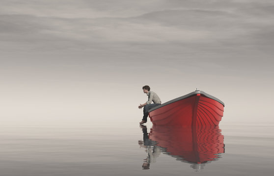 Man sits on the edge of a boats