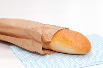 french bread with paper bag on white background