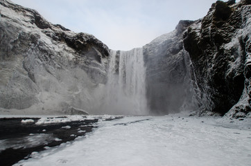 Skógafoss, Iceland, waterfall in Icelandic nature landscape. Famous tourist attractions and landmarks destination in Icelandic nature landscape on South Iceland. Winter