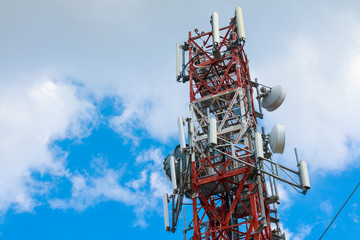 Communication tower on blue sky. top of a cellular repeater tower for 2g 3g and 4g transmission....