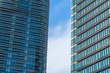Modern office building against blue sky